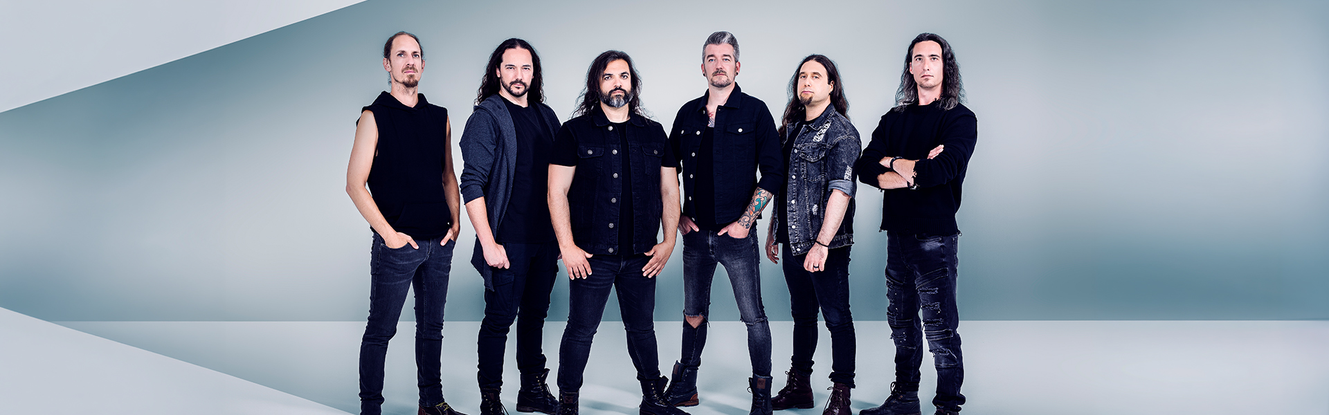 Textures full six-member band lineup posing together in a promotional photo for their India 2025 return shows